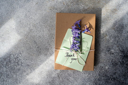 Gift box with thank you card and purple hyacinth