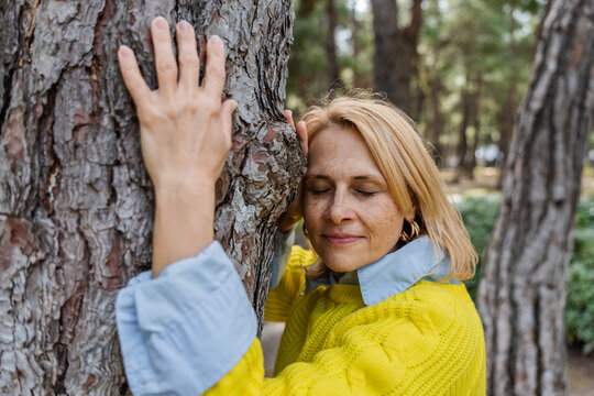 Woman embracing nature in serene outdoors moment