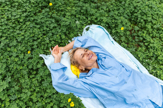 Woman relaxing outdoors in natural setting