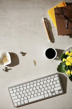 Morning workspace with coffee and flowers