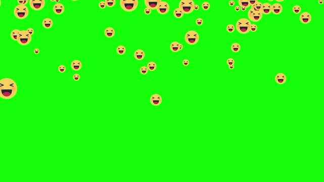 Yellow smiling faces float across bright green screen
