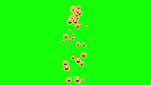 Yellow smiley faces fall down a green screen