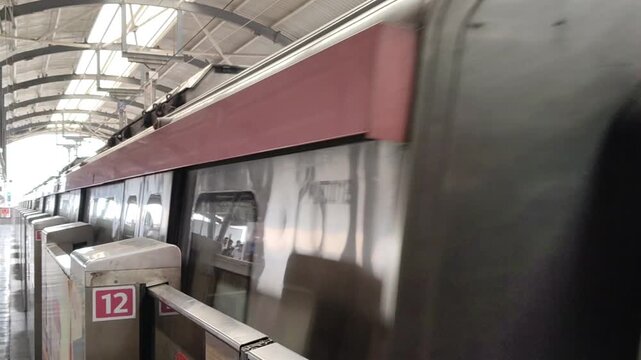 New Delhi, India, April 16 2026 - Delhi Metro train arriving at Jhandewalan metro station in New Delhi, India, Asia, Public Metro departing from Jhandewalan station