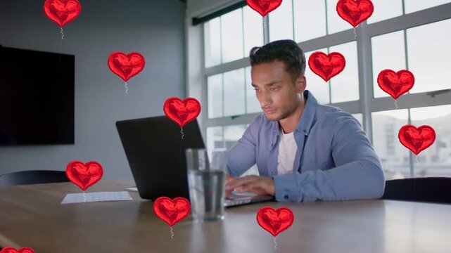 Man typing, hearts emerging after typing and spreading across torso and laptop for marketing
