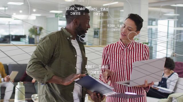 Man and woman reviewing folder and laptop during business review touching screen showing AR charts