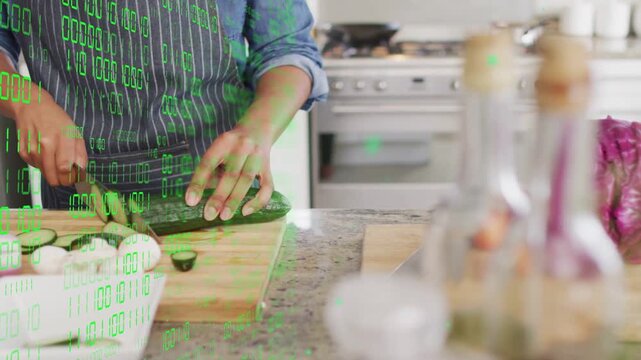Female cook grasping cucumber, slicing on countertop, prepping salad with green binary overlay