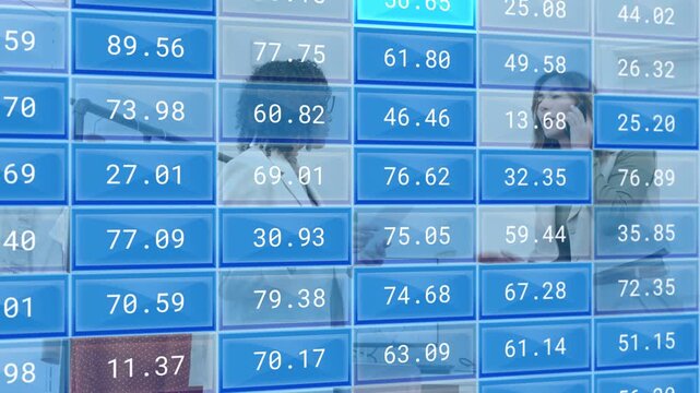 Left woman offering docs pointing at screen driving blue tiles updating fashion metrics for restock