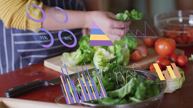 Food creator reaching for lettuce, AR graphs around hands, tearing leaves into bowl for salad