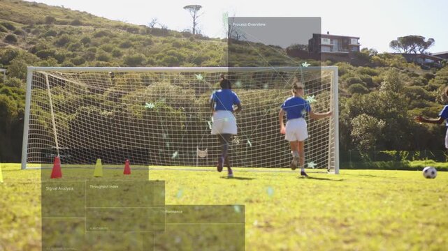 Two players defending net, rolling ball starting shot for soccer, overlays marking cones or position