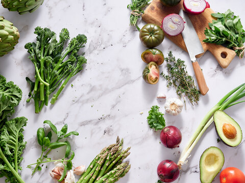 Fresh vegetables on marble counter for healthy meal prep
