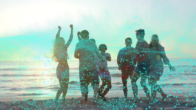 Group of seven adults celebrating on beach at sunset turquoise particles sweeping initiating travel