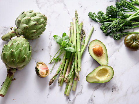 Fresh vegetables on marble countertop for healthy meal prep