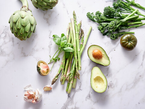 Fresh vegetables on marble countertop for healthy meal prep