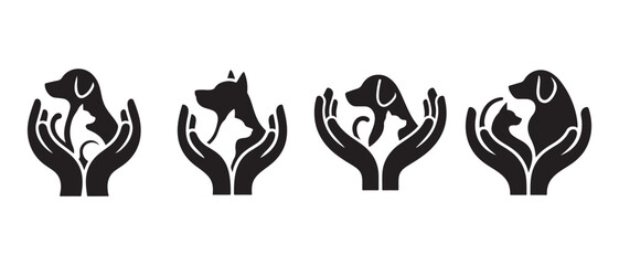Fototapeta premium Hands holding dog and cat silhouettes. on White Background.