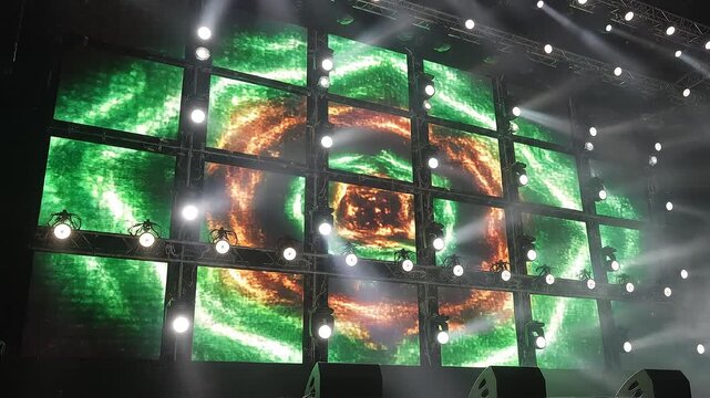 Close-up and wide-angle cinematic shots of a massive LED wall stage setup with 27 synchronized screens