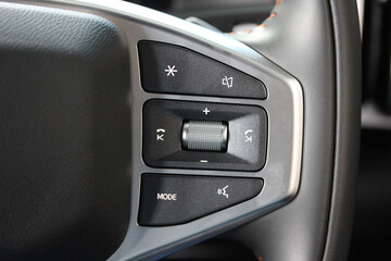 Obraz premium Audio buttons on the right side of a new vehicle steering wheel