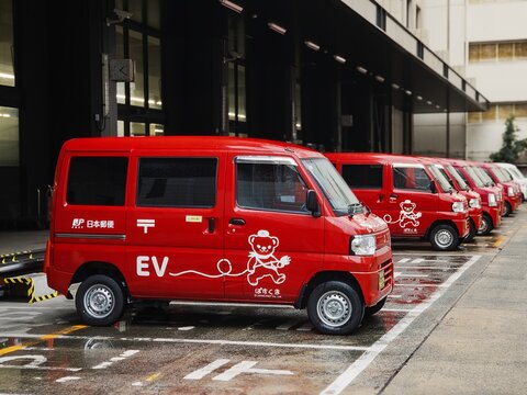 Japan Post EV car delivery service parking at Post office building : Fukuoka, Japan - Mar 19, 2026 