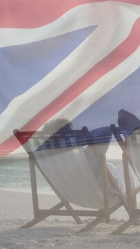 Vertical video: Seniors sitting on chairs, breeze drifting flag and casting colored veil for travel