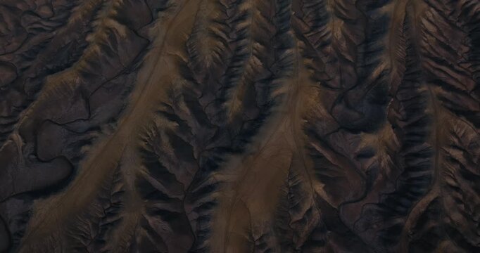 Shadowed desert badlands ridges and erosion patterns near Factory Butte Utah, drone