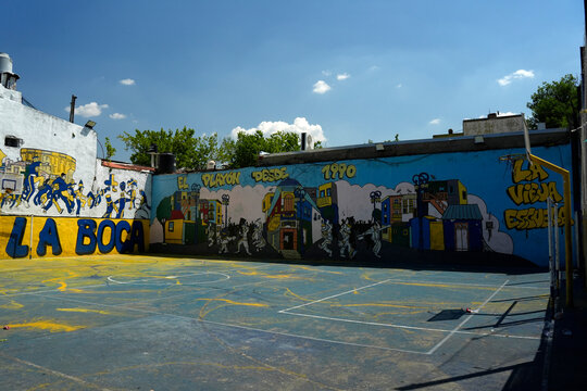 BUENOS AIRES, ARGENTINA - JANUARY 15 2026 - Concrete soccer fields where Young players playing soccer in la Boca streets