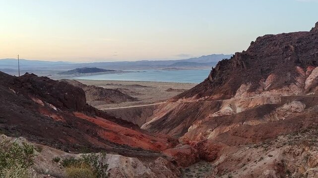 Scenic panoramic view of the Grand Canyon West Rim in Arizona, USA. Desert landscape with layered red rock cliffs, deep canyon formations, Colorado River view. A road trip near Eagle and Guano Point.