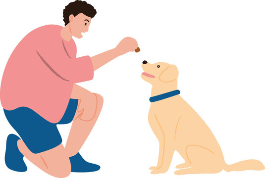 Young Man Training and Rewarding Obedient Dog with a Treat 