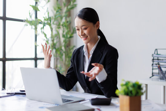 Asian businesswoman having online video call or meeting
