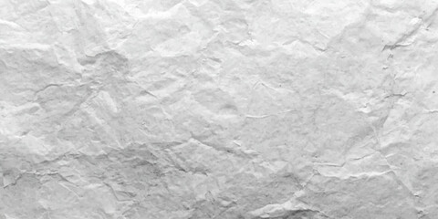 Naklejka premium A vintage blank white sheet of crumpled paper displays a rough creased texture and wrinkled grunge pattern, creating a crushed material surface perfect for a textured design background