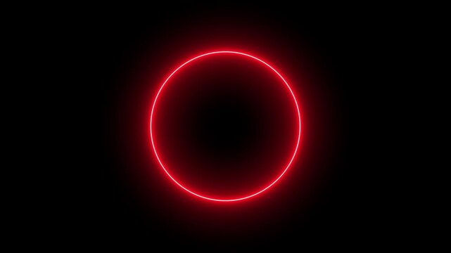 Bright red neon circle glowing in the dark as a simple light frame shape for digital design and vibrant abstract art