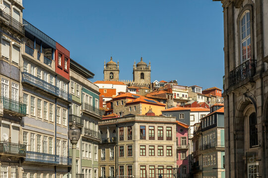 Portugal, Northern Portugal, Porto, Apartment buildings with twin bell towers looming in background