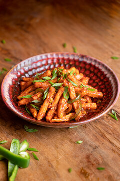 Crispy potato sticks tossed in a spicy, tangy sauce and topped with fresh chopped green onions.