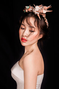 Sexy Asian wedding dress woman against a black background