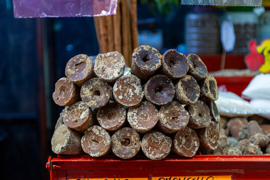Stacked Natural Piloncillo Cones as Sweetener Ingredient on a Market Stall
