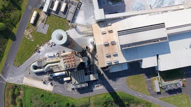 High angle aerial drone view of a large industrial glass manufacturing facility and factory in Goole United Kingdom