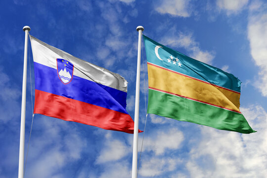 Slovenia and Karakalpakstan flags waving in a clear blue sky, symbolizing a powerful diplomacy, expanding global trade, a strategic partnership, and a shared vision of unity for a sustainable future.