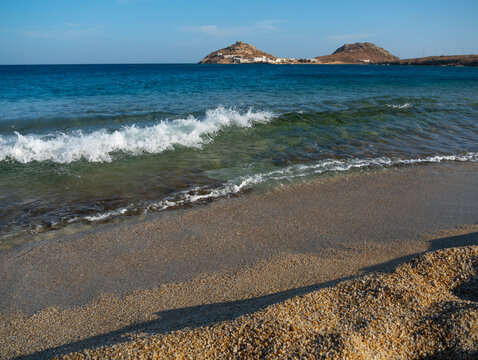 View from Kalafati beach to the fishing village on the island of Mykonos in Greece