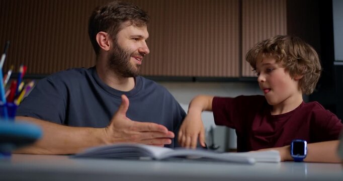 Father And Son Enjoy Interactive Educational Time. Father And Son Share Happy Learning Experience Together