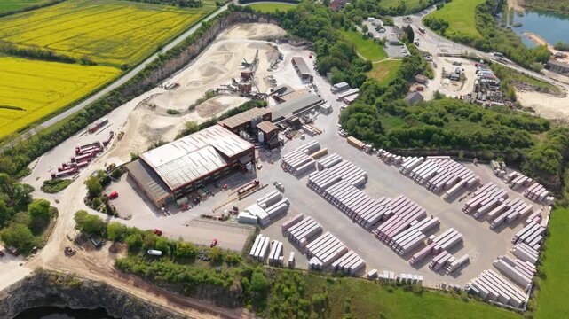 Top down aerial view of an industrial quarry facility with conveyor belts and grading machinery in Maltby UK