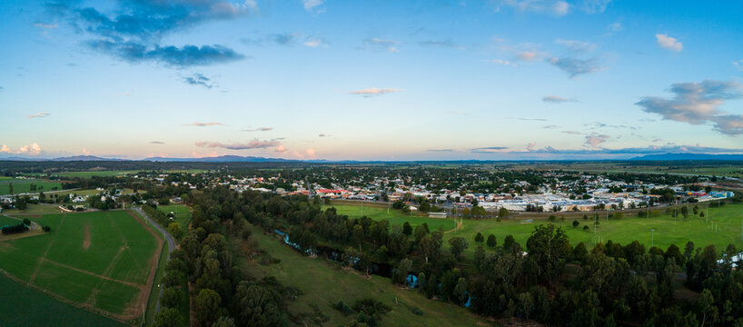 Panoramic aerial view of singleton at dusk showing Hunter River and playing fields and town