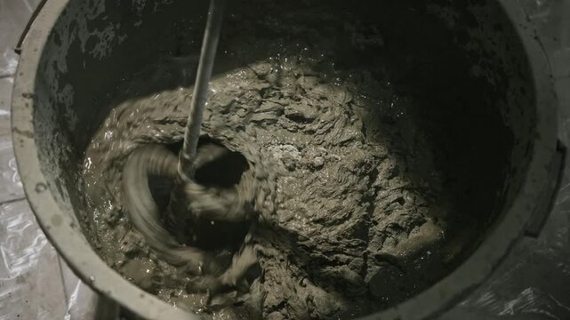 Practical Renovation Scene Showing Gritty Concrete Mixing Process With Onsite Equipment And Workflow