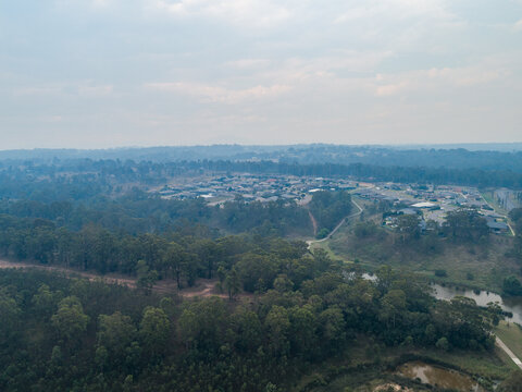 Smoke filled sky over town with distant bushfires burning in australia