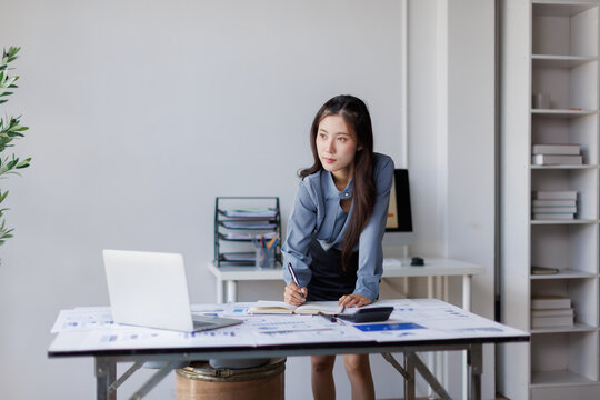 Businesswoman analyzing corporate data for financial report