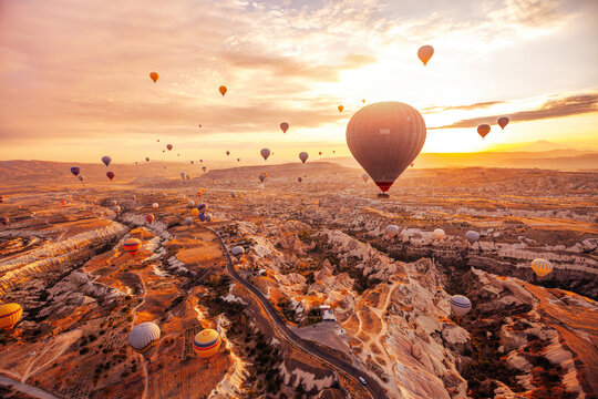 travel background, inspiration, hot air ballons in Turkey flying at sunrise sky, inspiring landscape