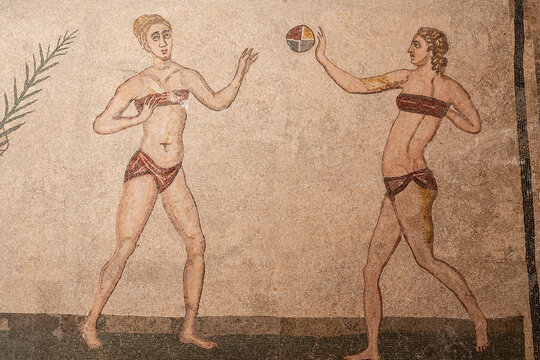 Woman from ancient Rome training in a bikini with a ball,  &ldquo;Hall of the Bikini Bathers&rdquo;, Roman Villa of Casale, Piazza Armerina, Sicily, Italy, Europe