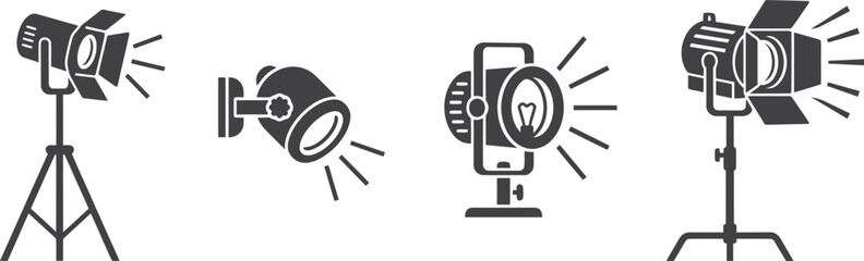 Four different studio spotlight lamps on stands isolated on white background, Vector © DesignVirtuoso