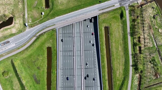 Top view of a road aqueduct above a busy highway in Europe