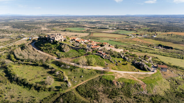 Figueira de castelo rodrigo village and castle ruins overlooking rural landscape