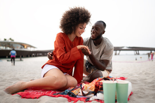 Happy diverse couple enjoying a romantic summer vacation and celebrating their love together
