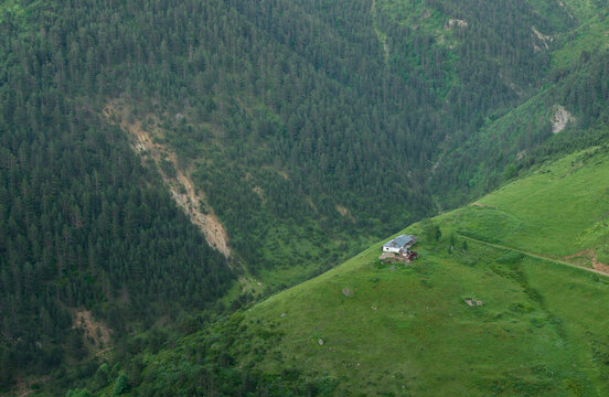 An old shelter on a mountainside. Minimalist lifestyle.