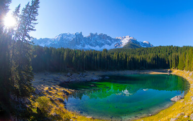 Obraz premium Lake Carezza is a small mountain lake in the Dolomites in South Tyrol, Italy.